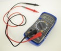 Red and black wire probe connected to a multimeter