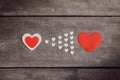 Red blank paper note with heart shape on grunge wooden background Royalty Free Stock Photo