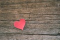 Red blank paper note with heart shape on grunge wooden background Royalty Free Stock Photo