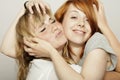 Red and blond haired girls tousle hair Royalty Free Stock Photo