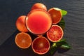 Red blood oranges juice on a slate plate Royalty Free Stock Photo