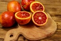 Red blood oranges on wooden table Royalty Free Stock Photo