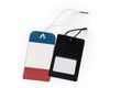 Red blue and black carton clothing swing tags on ropes Royalty Free Stock Photo