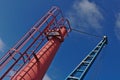 Red and blue boat crane with blue sky Royalty Free Stock Photo
