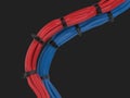 Red and blue cables bunched together and held together with zipties Royalty Free Stock Photo