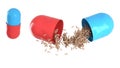 Red-blue capsule being opened pellets spill out.