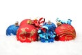 Red,blue christmas decoration on snow in line Royalty Free Stock Photo