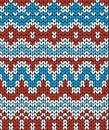 Red and blue Christmas seamless pattern. Knitting traditional texture. Winter background.