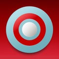 a red and blue circular button on a red background