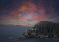 Moody sunset cloudy image of Oregon Coastline lighthouse Royalty Free Stock Photo