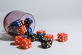 The red and blue dice lie on a white background and are scattered in a chaotic manner Royalty Free Stock Photo