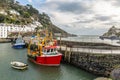 Red and Blue fishing boats moored at Polperro Harbour, Cornwall, UK Royalty Free Stock Photo