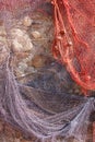Red and blue fishing nets hanging upon a wall Royalty Free Stock Photo