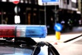 Red and blue flashing lights of the police car in the checkpoint