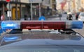 Red and blue flashing lights of the police car of the metropoli