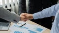 Businessmen tie together during a meeting after signing a deal and a successful business partnership. Royalty Free Stock Photo