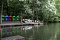 Red, blue and green beach houses near a lake Royalty Free Stock Photo