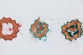 Red, blue and green colored pencil shavings on white background Royalty Free Stock Photo