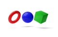 Red, blue and green geometric primitives, sphere, cube and torus on white background, modern minimal template concept