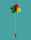 Red, blue, green, orange and yellow paper balloons and color pencils on pastel background. Minimal fun back to school concept Royalty Free Stock Photo