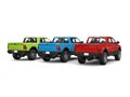 Red, blue, green pick-up trucks - back view Royalty Free Stock Photo