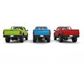 Red, blue, green pick-up trucks - rear view