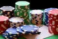 Red, blue, green, white and black poker chips pile and aces Royalty Free Stock Photo