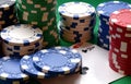 Red, blue, green, white and black poker chips pile and aces Royalty Free Stock Photo