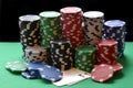 Red, blue, green, white and black poker chips pile and aces Royalty Free Stock Photo