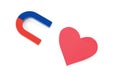 Red and blue horseshoe magnet and paper heart on background, top view