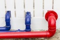 Red and blue industrial pipe on the wall Royalty Free Stock Photo