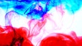 Red and blue ink in water.Creative slow motion. On a white background. Abstract background. Royalty Free Stock Photo