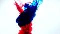 Red and blue ink in water.Creative slow motion. On a white background. Abstract background. Royalty Free Stock Photo