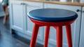 Red and blue kitchen stool in modern home setting. Royalty Free Stock Photo