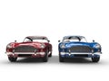 Red and blue metallic vintage cars - front view Royalty Free Stock Photo