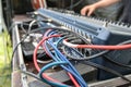 Red and blue microphone cables connected in a sound mixing console at the soundcheck for an open air music festival, selected Royalty Free Stock Photo