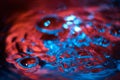 Red and blue neon background from water surface with bubbles Royalty Free Stock Photo
