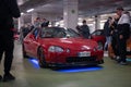 red with blue neon Honda Civic CR-X Del Sol tuned by Mugen at a parking rally