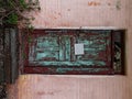 Red blue old wooden door on a pink brick wall Royalty Free Stock Photo