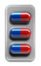 Red and blue pills in blister packaging isolated on white background Royalty Free Stock Photo