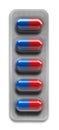 Red and blue pills in blister packaging isolated on white background Royalty Free Stock Photo