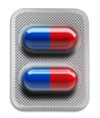 Red and blue pills in blister packaging isolated on white background Royalty Free Stock Photo