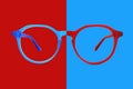 Red and blue plastic color eye glasses isolated on background, ideal photo template for display or advertising sign or for a web Royalty Free Stock Photo