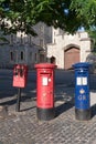 Red and blue postboxes and stamp machine, Windsor, Berkshire, England, United Kingdom