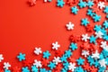 A red and blue puzzle pieces on a bright orange background, AI Royalty Free Stock Photo