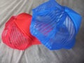 Red and blue small net work caps Royalty Free Stock Photo