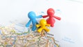 A Toy figure family standing on Palermo on a map of Italy Royalty Free Stock Photo