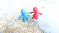 A Toy figure couple standing on Palermo on a map of Italy Royalty Free Stock Photo