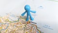 A Toy man standing on Palermo on a map of Italy Royalty Free Stock Photo