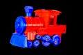 A red and blue toy train with a blue engine Royalty Free Stock Photo